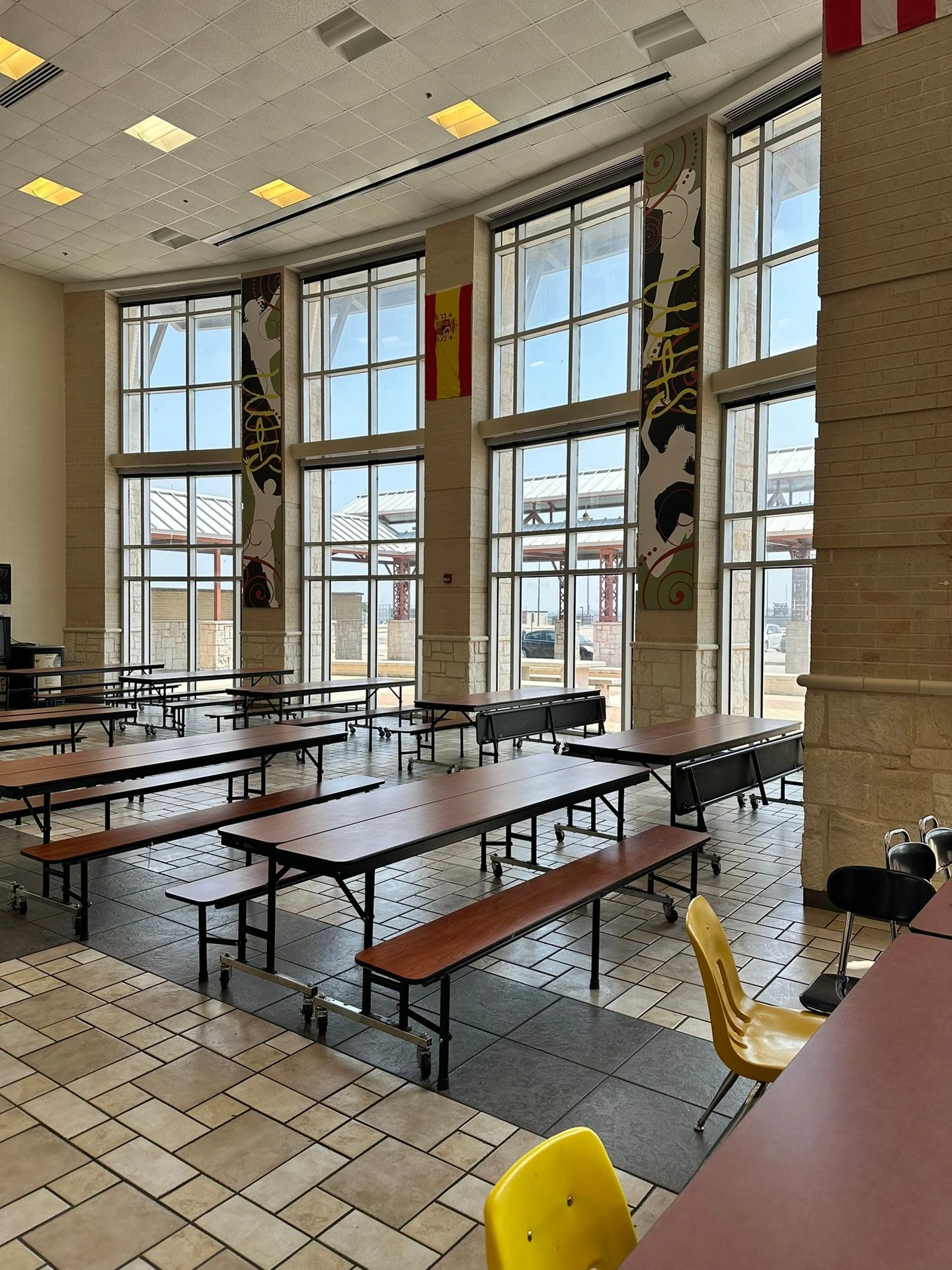 Two-story school commons glass with security film