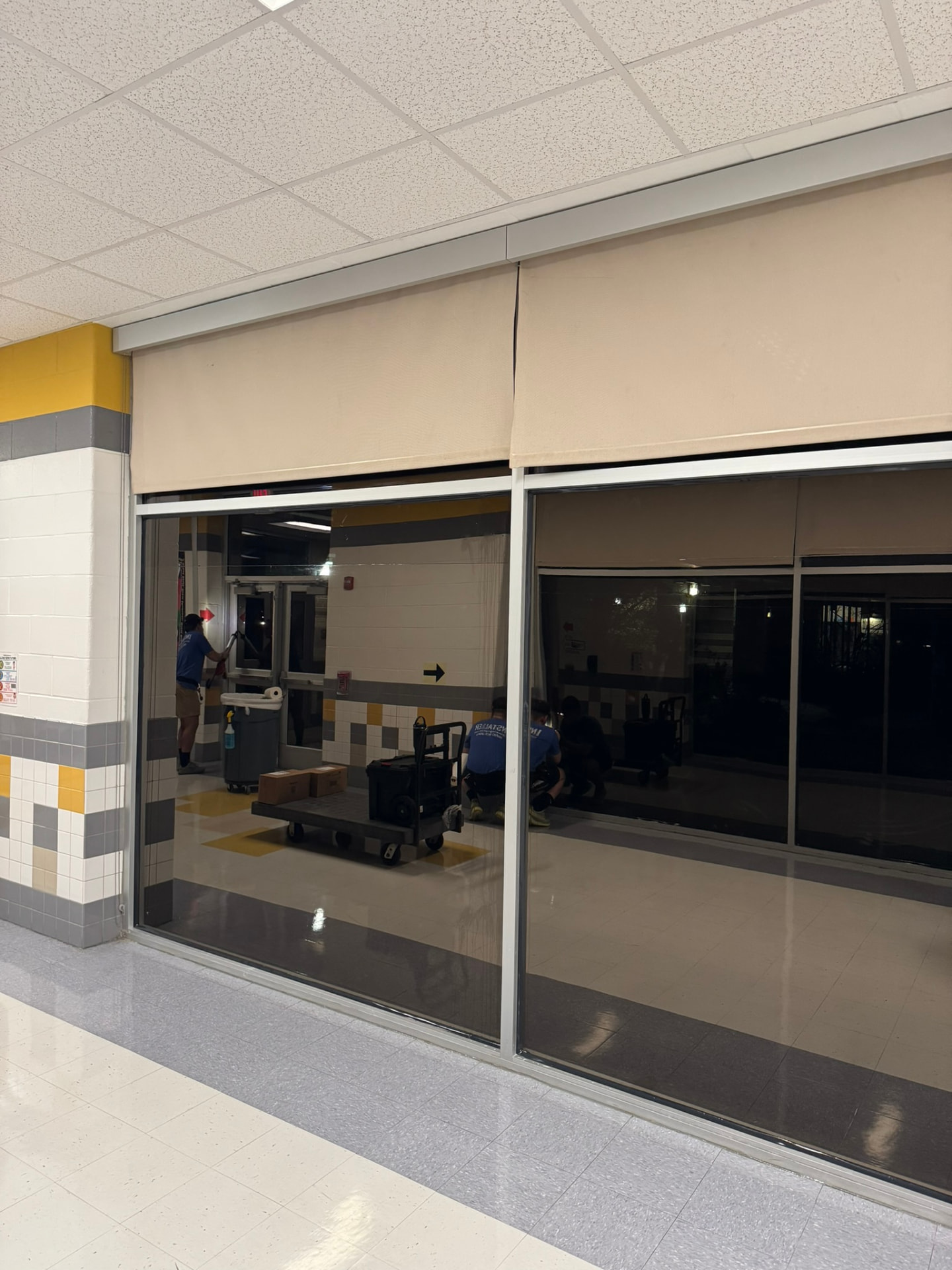 School hallway glass treated with security window film